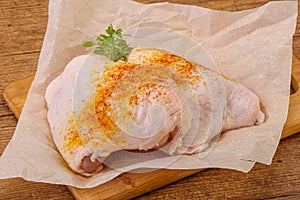 Raw chicken thigh with spices