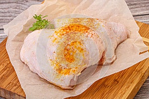 Raw chicken thigh with spices