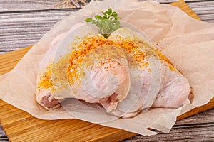 Raw chicken thigh with spices