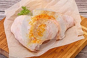 Raw chicken thigh with spices