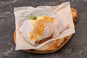 Raw chicken thigh with spices