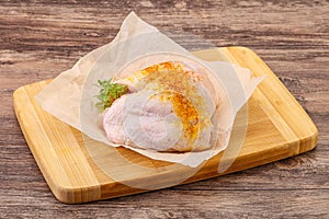 Raw chicken thigh with spices