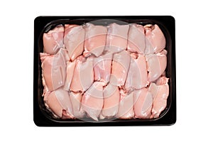 Raw chicken thighs boneless Skinless in packaging tray.Lots of Chunks of Fresh Skinless Chicken Thigh in a Plastic Supermarket