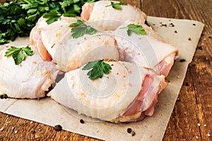 Raw chicken thighs with parsley