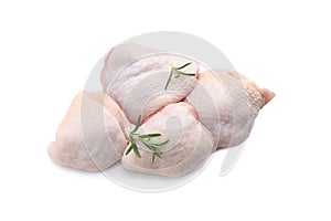 Raw chicken thighs with rosemary on white background, top view