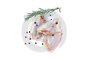 Raw chicken wings with garlic, pepperand rosemary isolated