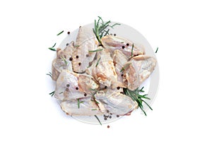 Raw chicken wings with garlic, pepperand rosemary isolated