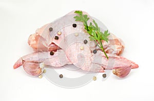 Raw chicken wings isolated on white background - fresh uncooked chicken meat with herbs and spices for cooking food