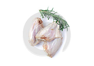 Raw chicken wings with rosemary isolated on white background