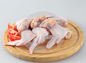 Raw chicken wings on a white background