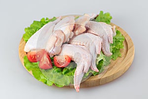 Raw chicken wings on a white background