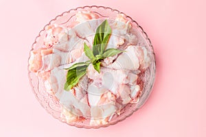 Raw chickens on plate