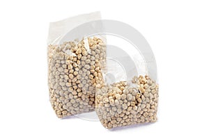 Raw chickpeas isolated on a white background. Chickpea background. Healthy vegetarian food concept. Pile of uncooked chickpeas.