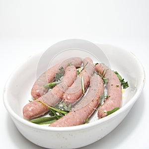 Raw chipolata sausages