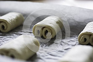 Raw chocolate croissants prepared for baking