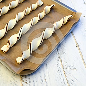 Raw chocolate puff pastry twists breadsticks freshly prepared fo