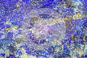 Raw close-up macro Lapis Lazuli crystal chunk, unpolished stone, deep blue lazurite