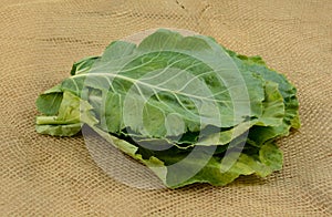 Raw collard greens on burlap