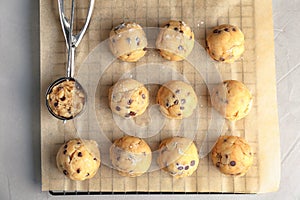 Raw cookie dough with chocolate chips and scoop photo