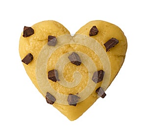Raw cookie dough with chocolate chips in the shape of a heart, symbol of love, top view.