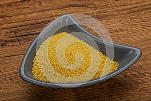 Raw cous cous heap in the bowl