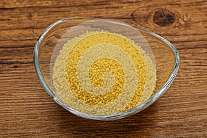 Raw cous cous heap in the bowl