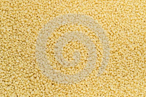 Raw couscous groats healhty food background