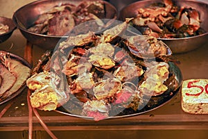 Raw crab meat cut in half. Selling fresh seafood at a fish market. Hong Kong.