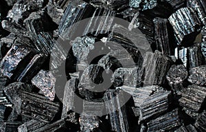 Raw crystal of black Tourmaline Schorl gemstone photo
