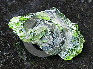 raw crystal of Chrome Diopside gemstone on dark