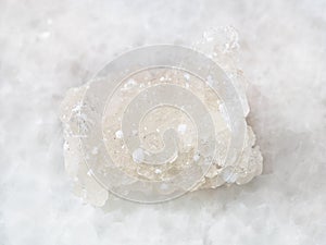 raw crystal of Prehnite with Okenite on white