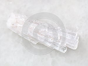 raw crystal of Scolecite gemstone on white photo