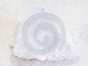 raw crystalline Magnesite stone on white marble