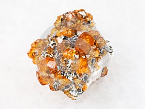 raw crystals of spessartine garnet stone on white photo