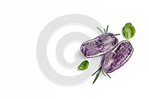 Raw cut purple sweet potatoes isolated on white background. Ipomoea batatas. Batata potato. Long banner format. top view