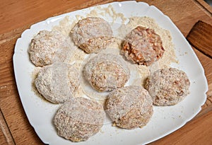 Raw cutlets of the beef and pork raw minced meat