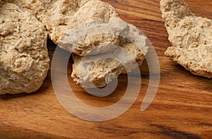 Raw Dehydrated Soy Meat or Soya Chunks on Wood Background