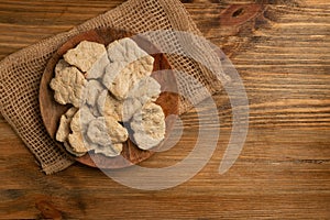 Raw Dehydrated Soy Meat or Soya Chunks on Wood Background