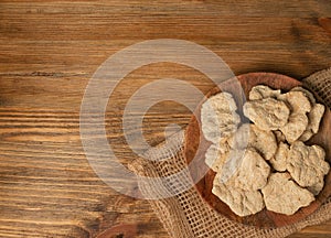 Raw Dehydrated Soy Meat or Soya Chunks on Wood Background