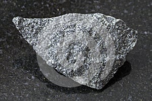 raw dolerite stone on dark background