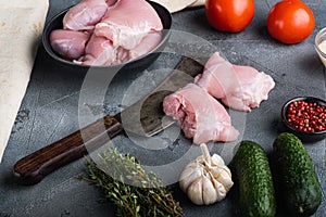 Raw doner ingredients, chicken meat on grey background