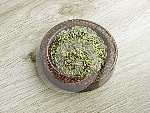 Raw Dry Organic Fennel Seeds in dish photo