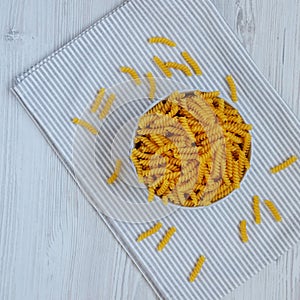 Raw Dry Organic Rotini Pasta Ready to Cook. Top view, from above, flat lay. Copy space