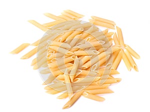 Raw and dry Penne noodles, isolated on a white background. Italian uncooked wheat pasta, close-up. Flour products.