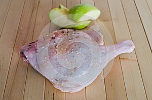 Raw duck flesh with halved. Raw duck meat. Spiced duck. Preparation of duck before baking on wooden background