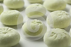 Raw dumplings on white background, closeup.