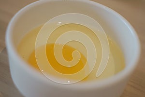 Raw egg in cup for food background