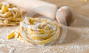 Raw egg pasta with flour and rolling pin