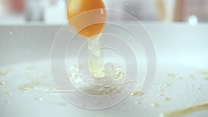Raw Egg for Scrambled or Fried Egg Falling onto Frying Pan in Macro 1000fps (Phantom Flex)