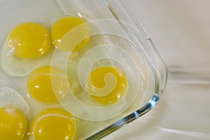 raw egg yolks in a glass bowl